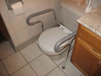 Photo of an accessible restroom in Milwaukee Idea Home with grab bars
