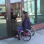 Photo depicting inaccessbility of a door for an individual in a wheelchair