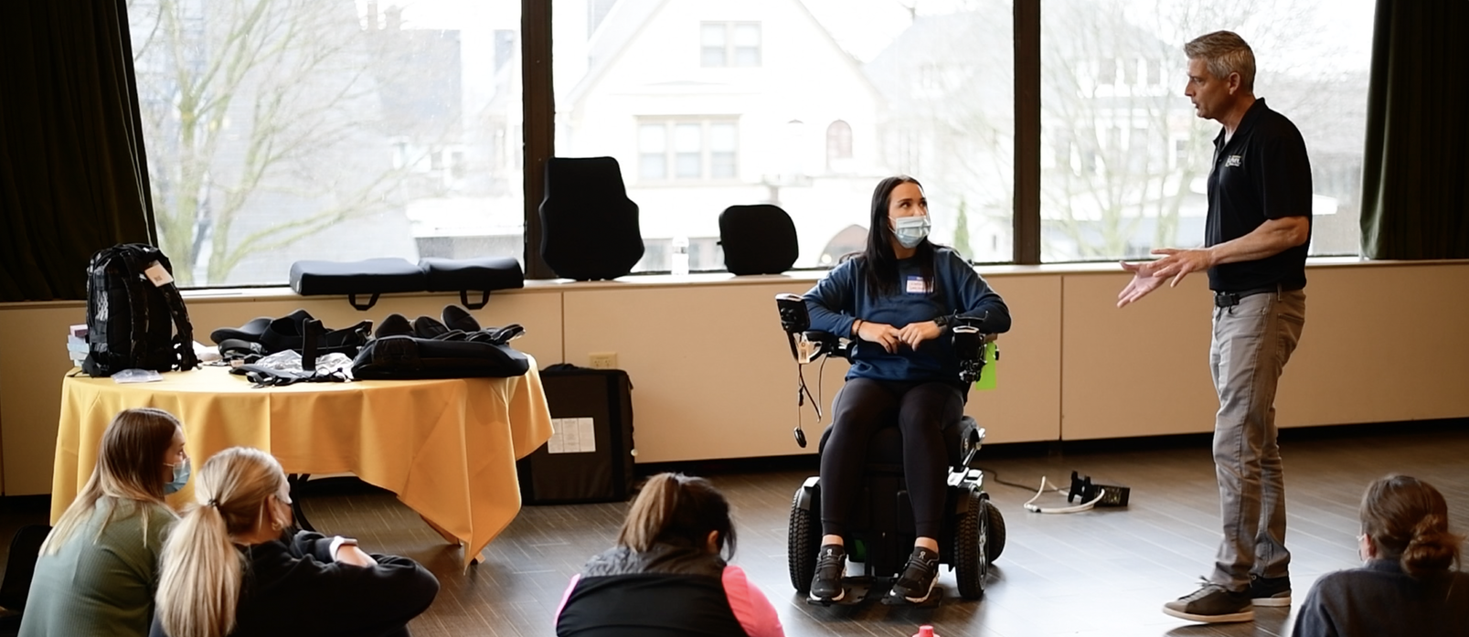 Image of Wheelchair Vendor Lecturing on Different Wheelchair Cushions
