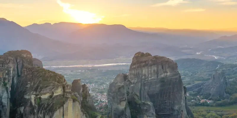 sunset/sunrise over a mountain range