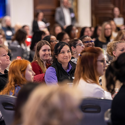 Women listening to the keynote speaker at the Women Leaders Conference