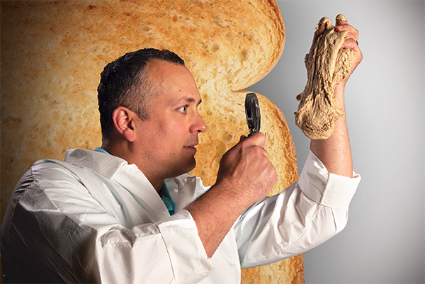 professor examining bread