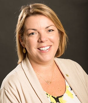 Portrait of Erica Yewlett (white woman), unit business representative