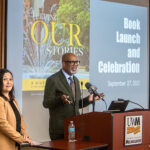 Dr. Chia Vang (Hmong woman) and Dr. David J. Pate Jr. (Black man) giving a presentation during the launch for their book: "Telling Our Stories: A History of Diversity at the University of Wisconsin-Milwaukee, 1956-2022."