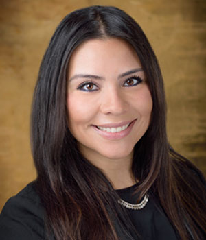 Headshot of Latina professional.