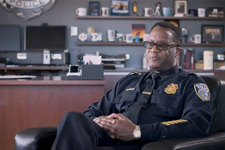 Milwaukee Chief of Police (Black professional male) in his office.