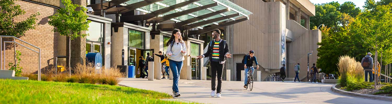 Students entering and leaving the UW-Milwaukee student union.