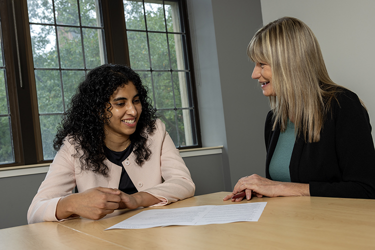 Accelerated Graduate Degree student Ansa Joseph works with a tutor.