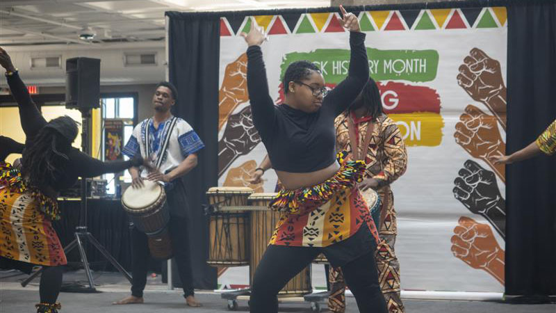 Dancers and musicians performing
