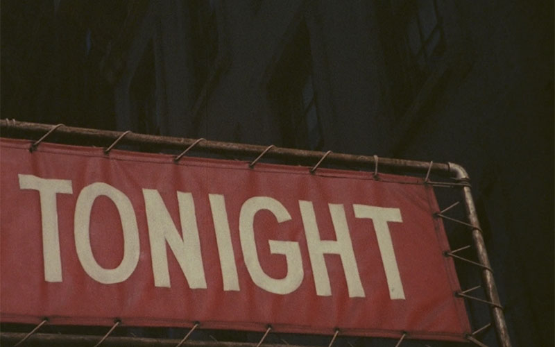 White text TONIGHT on red fabric sign