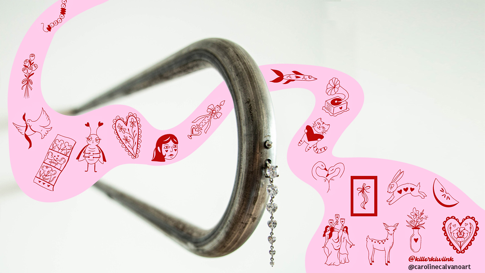 Gemini said An artistic composition featuring a curved, dark, textured object—resembling a large metal hook or an animal horn—set against a clean white background. A flowing, whimsical pink ribbon winds around the object, decorated with various red and black illustrations, including hearts, a small insect, a human profile, a deer, and other abstract symbols. The overall style blends natural or industrial textures with playful, illustrative elements.