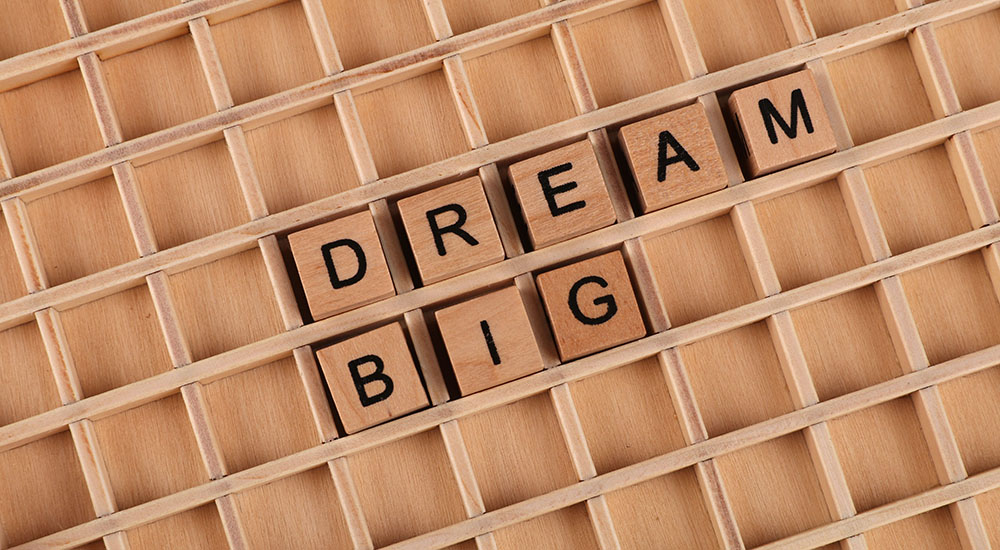 Letter Tiles spelling the words Dream Big