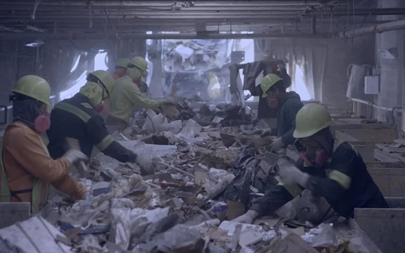 Frame of film In Excess of workers process garbage