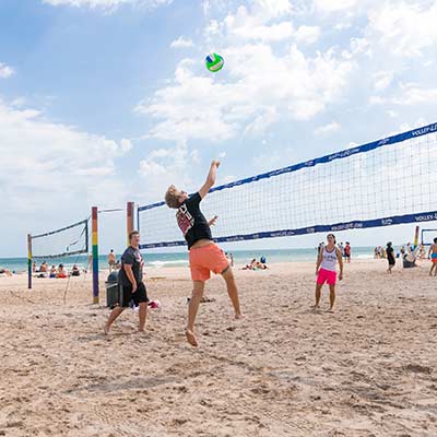 UWM students playing volley ball on the beach