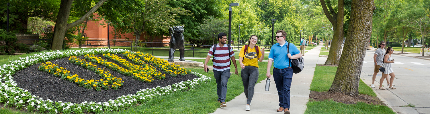 Three UWM students walking on campus