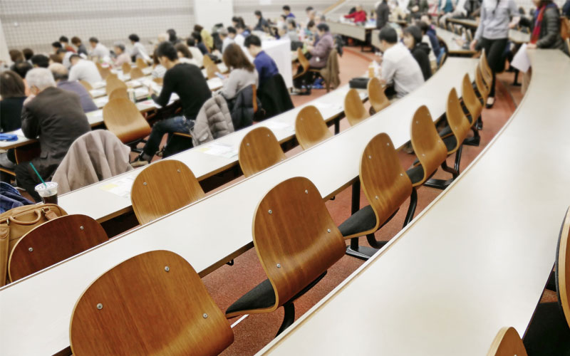 rows of desks in lecture hall