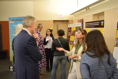Panelists having discussion with the student