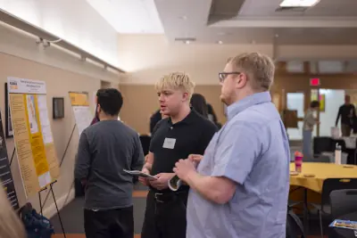 A student looking at a poster