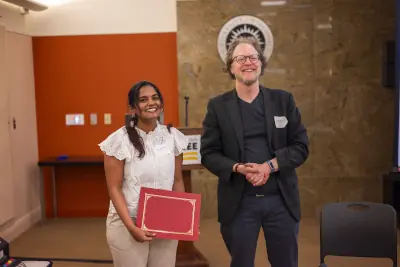 Maria Francis receiving her award
