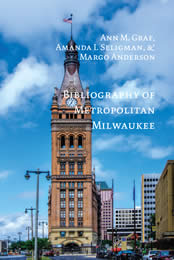 book cover for Bibliography of Metropolitan Milwaukee shows a photo of City Hall against a blue sky
