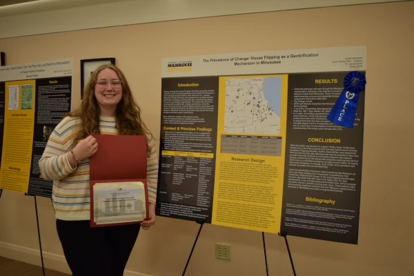 Caitlin Monahan with award
