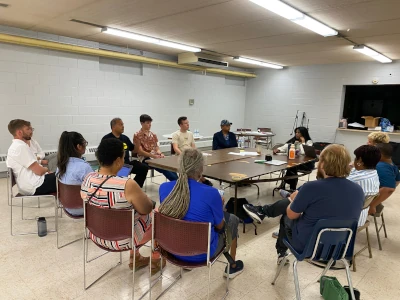 Group of people surrounding a table 