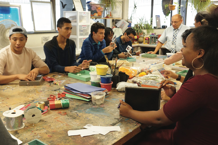 Students work on arts and crafts.