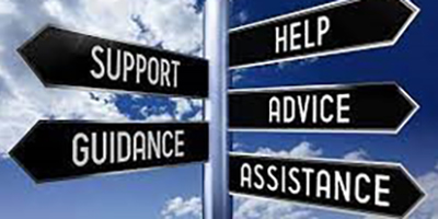 A photo of a multi-directional sign in the sky, pointing towards support, guidance, help, advice, and assistance