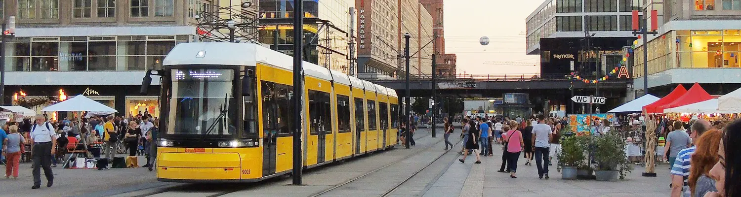 street scene in Berlin with train on street