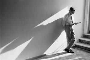 person leaning against a wall