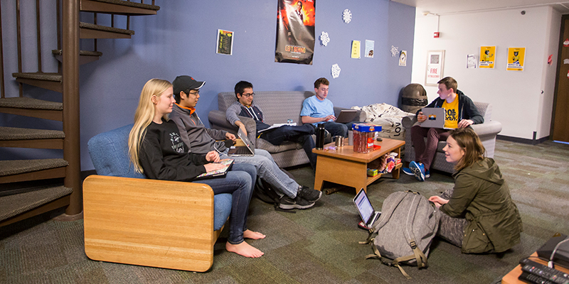 Students gathered in a dorm common area