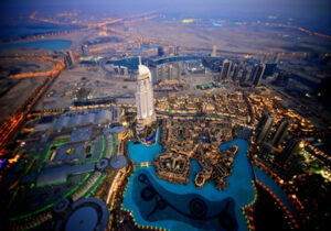 Drone view of a large metropolitan city lit up