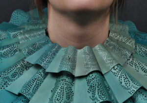 Closeup of teal Elizabethan-esque collar