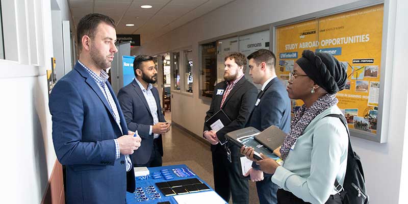 Recruiters interacting with students at a job fair
