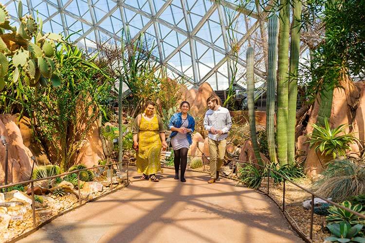 Students walking through the Mitchell Park botanical domes