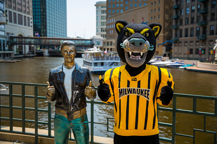 Pounce posing with the Bronze Fonz in downtown Milwaukee