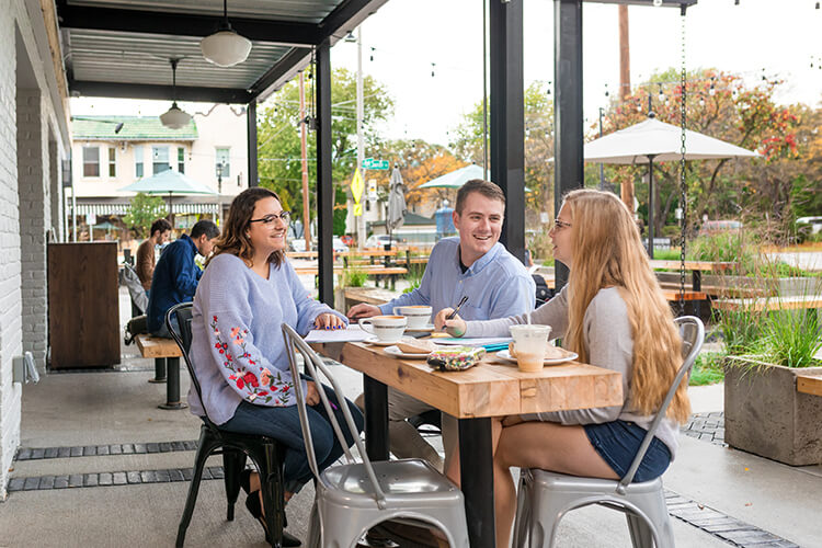 Students enjoying coffee at a coffeeshop near campus