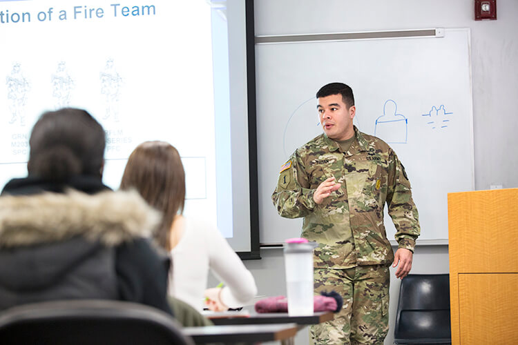 Major Daniel Bartlett teaches a military science class.