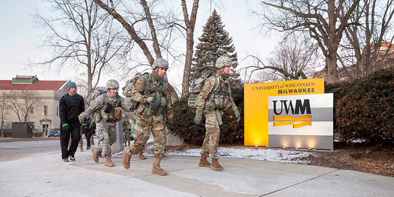 ROTC students in uniform walking on campus