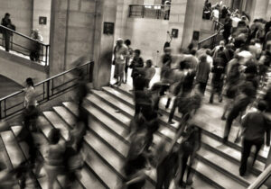 Black and white long exposure photo of crowds on staircases