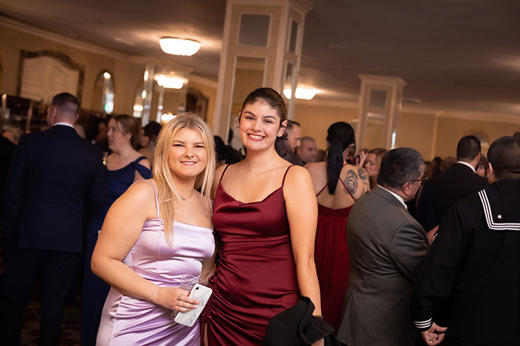 Two female UWM students at veterans ball