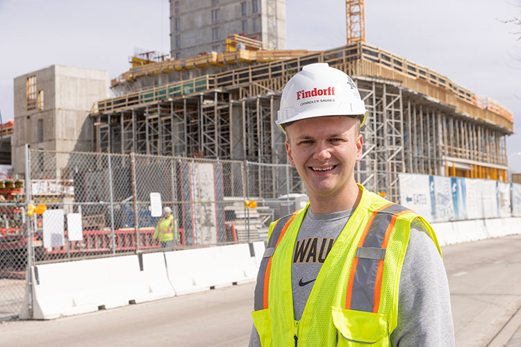 Civil engineering major Chandler wearing safety equipment at construction site